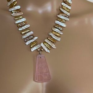 Necklace with a 2 inch rose quartz pendant and ‘Mother of  Pearl’ chain.